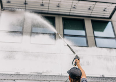 Pressure washing a commercial property.